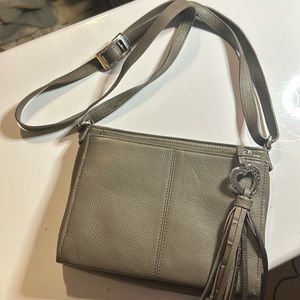 brighton purse. it’s grey and has many pockets and a built in willer area!